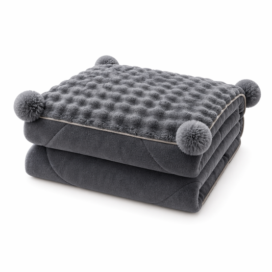 A Cloud-Soft Pillow That Unfolds Into a Throw-Bubble Texture, Pom-Pom Charm