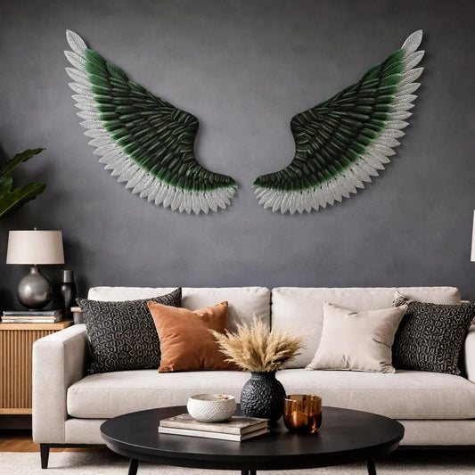 Close-up of layered feather texture on green and silver metal wing wall art