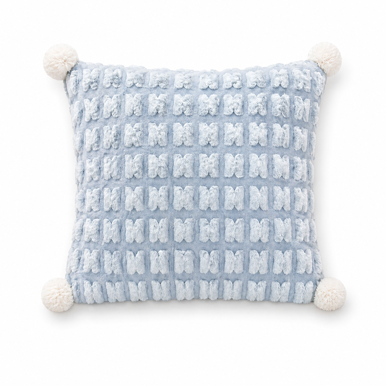A Chic Pillow That Unfolds Into a Throw-Textured Grid + Pom-Poms for Instant Style