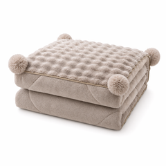 A Cloud-Soft Pillow That Unfolds Into a Throw-Bubble Texture, Pom-Pom Charm