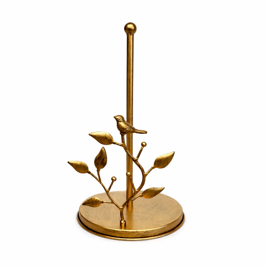 Antique brass decorative paper towel holder with sculptural vine accent on kitchen counter