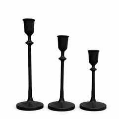  Heavy cast iron taper candle holders on dining table centerpiece