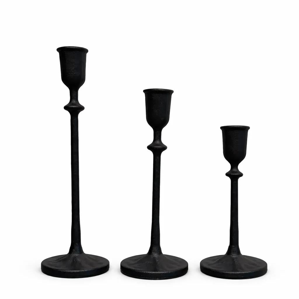  Heavy cast iron taper candle holders on dining table centerpiece